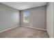Neutral bedroom with carpeted flooring, a window with blinds, and closet at 1107 Seminole Sky Dr, Ruskin, FL 33570