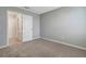 Neutral bedroom with carpeted flooring and a connecting hallway at 1107 Seminole Sky Dr, Ruskin, FL 33570