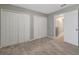 Neutral bedroom with carpeted flooring and large closets at 1107 Seminole Sky Dr, Ruskin, FL 33570
