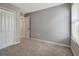 Bedroom with a double closet and a doorway leading to a bathroom at 1107 Seminole Sky Dr, Ruskin, FL 33570