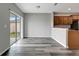 Bright dining area featuring wood-look floors and sliding glass doors to the backyard at 1107 Seminole Sky Dr, Ruskin, FL 33570