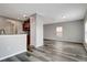 Open-plan living area with wood-look floors at 1107 Seminole Sky Dr, Ruskin, FL 33570