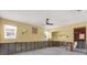 Bedroom remodel space with ceiling fan and showing renovation project at 11628 Grove St, Seminole, FL 33772