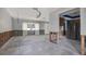Spacious living room with large windows, showcasing the potential for renovation and customization at 11628 Grove St, Seminole, FL 33772