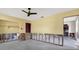Spacious living room displaying wall separation to bathroom and kitchen areas, showing renovation opportunity at 11628 Grove St, Seminole, FL 33772