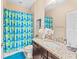 A bright bathroom with modern fixtures, granite countertop, and stylish accents at 11706 Gilmerton Dr, Riverview, FL 33579