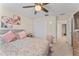 Comfortable bedroom with ceiling fan and a large window at 11706 Gilmerton Dr, Riverview, FL 33579