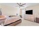 Bright bedroom with ceiling fan, window, and light pink decor at 11706 Gilmerton Dr, Riverview, FL 33579