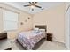 A cozy bedroom with a comfortable bed and neutral decor at 11706 Gilmerton Dr, Riverview, FL 33579