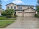 Charming two-story home with landscaped yard and a large two car garage and wide driveway at 11706 Gilmerton Dr, Riverview, FL 33579