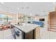 Bright, open-concept kitchen flows seamlessly into the living area, complete with a center island at 11706 Gilmerton Dr, Riverview, FL 33579