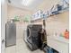 Well-equipped laundry room with modern appliances and a utility sink at 11706 Gilmerton Dr, Riverview, FL 33579