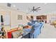 A cozy living room that connects seamlessly to the kitchen at 11706 Gilmerton Dr, Riverview, FL 33579