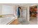 Bright main bathroom features a soaking tub, glass shower, and walk-in closet at 11706 Gilmerton Dr, Riverview, FL 33579