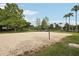 Community sand volleyball court surrounded by green lawns at 11706 Gilmerton Dr, Riverview, FL 33579
