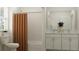 Bright bathroom with subway tile, double sink vanity, and a shower with a curtain and modern fixtures at 11761 E 71St Ter, Palmetto, FL 34221