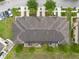 Overhead view of community pool with ample seating next to parking lot and community green space at 11903 Greengate Dr, Hudson, FL 34669