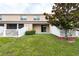 Spacious backyard with a well-maintained lawn, privacy fence, and mature tree at 11903 Greengate Dr, Hudson, FL 34669