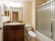 Bathroom boasts a vanity with granite counters and a shower with a glass door at 11903 Greengate Dr, Hudson, FL 34669