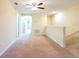 Open bonus room with plush carpet, ceiling fan and bright, neutral paint at 11903 Greengate Dr, Hudson, FL 34669