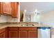Updated kitchen boasts granite countertops and stainless steel dishwasher at 11903 Greengate Dr, Hudson, FL 34669