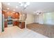 Open kitchen and living space boasts stainless appliances and a tile backsplash at 11903 Greengate Dr, Hudson, FL 34669