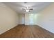 Bright living area with wood flooring, recessed lights, and multiple entryways at 11903 Greengate Dr, Hudson, FL 34669