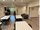 Large meeting area with multiple tables, chairs, kitchenette, and cozy seating, ideal for community events at 11903 Greengate Dr, Hudson, FL 34669