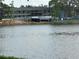 Modern building on a lake, with large windows and lakeside access and construction nearby at 1200 37Th N St # 403, St Petersburg, FL 33713