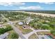 Aerial view of property showing spacious lot, fenced yard, mature trees, and neighborhood surroundings at 12279 Elmore Dr, Spring Hill, FL 34609