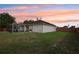 Backyard featuring enclosed patio and fenced perimeter, blending relaxation and security at 12279 Elmore Dr, Spring Hill, FL 34609