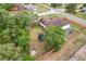 Aerial view of a lush backyard with a well-maintained lawn, trampoline, and privacy fence at 12279 Elmore Dr, Spring Hill, FL 34609