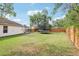 Expansive backyard featuring a trampoline and a well-maintained lawn, great for outdoor activities at 12279 Elmore Dr, Spring Hill, FL 34609