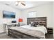 Bedroom with stylish wooden bed frame, desk, and neutral decor at 12279 Elmore Dr, Spring Hill, FL 34609