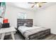 Bedroom with stylish wooden bed frame, desk, and neutral decor at 12279 Elmore Dr, Spring Hill, FL 34609
