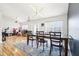Bright dining room featuring a large table, modern lighting, and stylish decor at 12279 Elmore Dr, Spring Hill, FL 34609