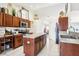 Well-lit kitchen features stainless appliances, a center island, and ample cabinet space at 12279 Elmore Dr, Spring Hill, FL 34609