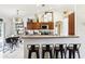 Spacious kitchen with bar seating, stainless steel appliances, and decorative accents at 12279 Elmore Dr, Spring Hill, FL 34609