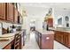 Spacious kitchen featuring granite countertops, stainless steel appliances, and ample storage space at 12279 Elmore Dr, Spring Hill, FL 34609