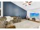 Inviting living room featuring a comfortable sofa, a large TV, and a cozy atmosphere at 12279 Elmore Dr, Spring Hill, FL 34609