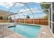 Inviting in-ground pool area, perfect for relaxation and outdoor entertaining in a private, screened enclosure at 12279 Elmore Dr, Spring Hill, FL 34609