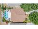 Bird's-eye view of a home featuring a private pool and lush landscaping at 12813 Kings Lake Dr, Gibsonton, FL 33534