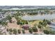 Aerial view showcases a community near a lake, with amenities like a playground, and a basketball court at 12813 Kings Lake Dr, Gibsonton, FL 33534