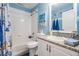 A cozy bathroom offers a shower and vanity at 12813 Kings Lake Dr, Gibsonton, FL 33534