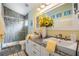The bathroom features dual sinks, a shower, and modern fixtures at 12813 Kings Lake Dr, Gibsonton, FL 33534