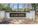 Entrance to Kings Lake neighborhood with a brick and painted white sign at 12813 Kings Lake Dr, Gibsonton, FL 33534