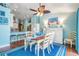 The dining room offers blue accents and decor at 12813 Kings Lake Dr, Gibsonton, FL 33534