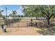 Community dog park featuring a picnic table, lake views, and a secure fence for off-leash fun at 12813 Kings Lake Dr, Gibsonton, FL 33534
