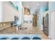 Bright kitchen with stainless steel appliances, granite countertops, and stylish tile backsplash at 12813 Kings Lake Dr, Gibsonton, FL 33534