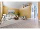 Stylish living room featuring modern furniture, neutral decor, and lots of sunlight at 12813 Kings Lake Dr, Gibsonton, FL 33534